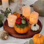 citrouilles creusées avec compositions végétales d’automne